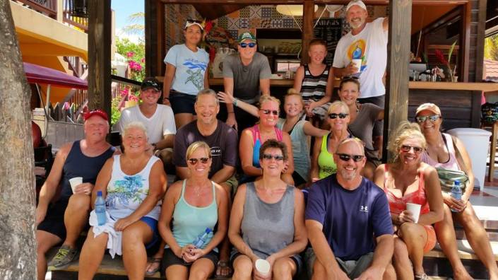 After two hours picking up trash in the broiling sun, why is this group smiling? Island love, for sure as well as iced coffee and cookies from Marbucks and chilled and scented washcloths from Pilates by Rose sure help.