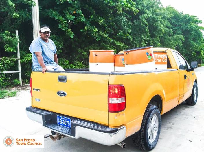 San Pedro town crew distributes new trash barrels north of the bridge on Ambergris Caye. (Photo courtesy SP Town Council)